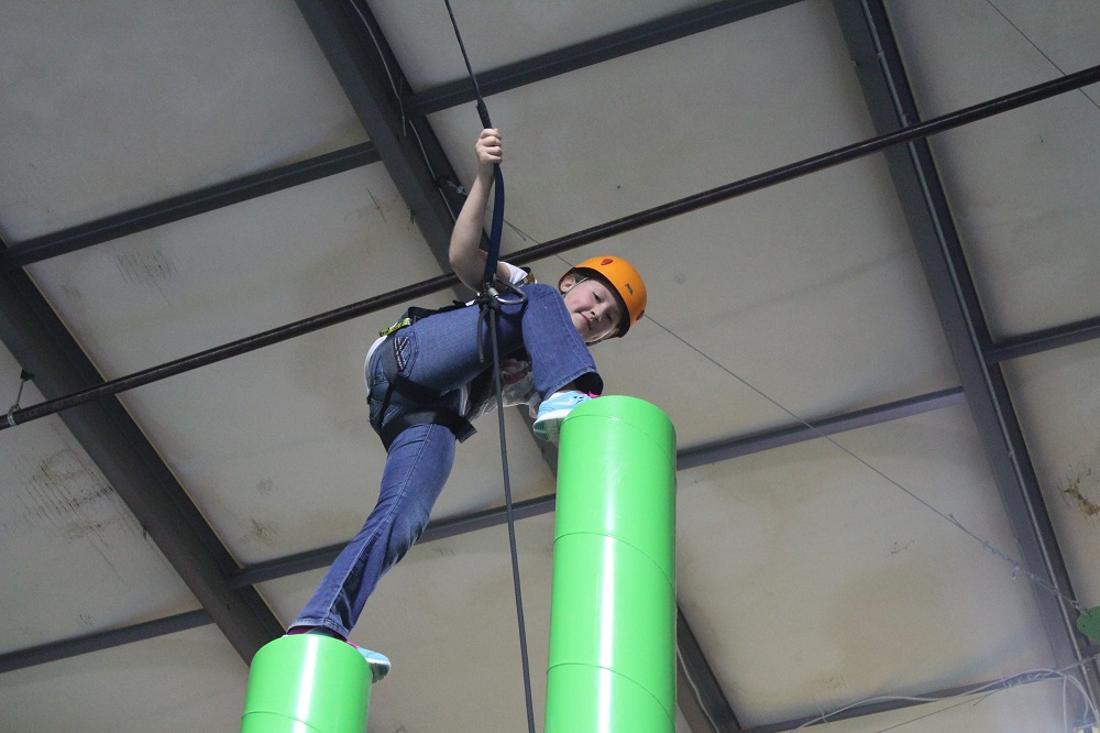 Kid Climbing Tall Totem