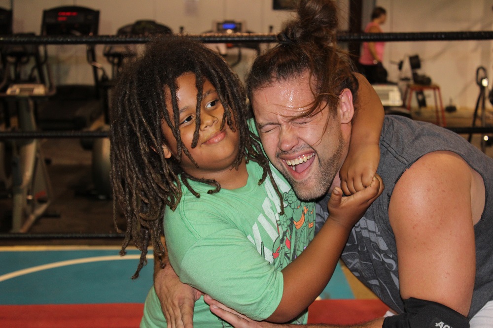 Deuce and Roc headlock        