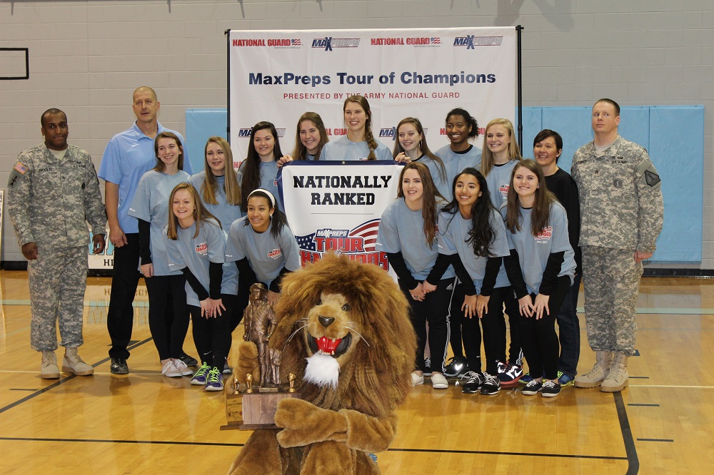 Warhill volleyball team posing with mascot